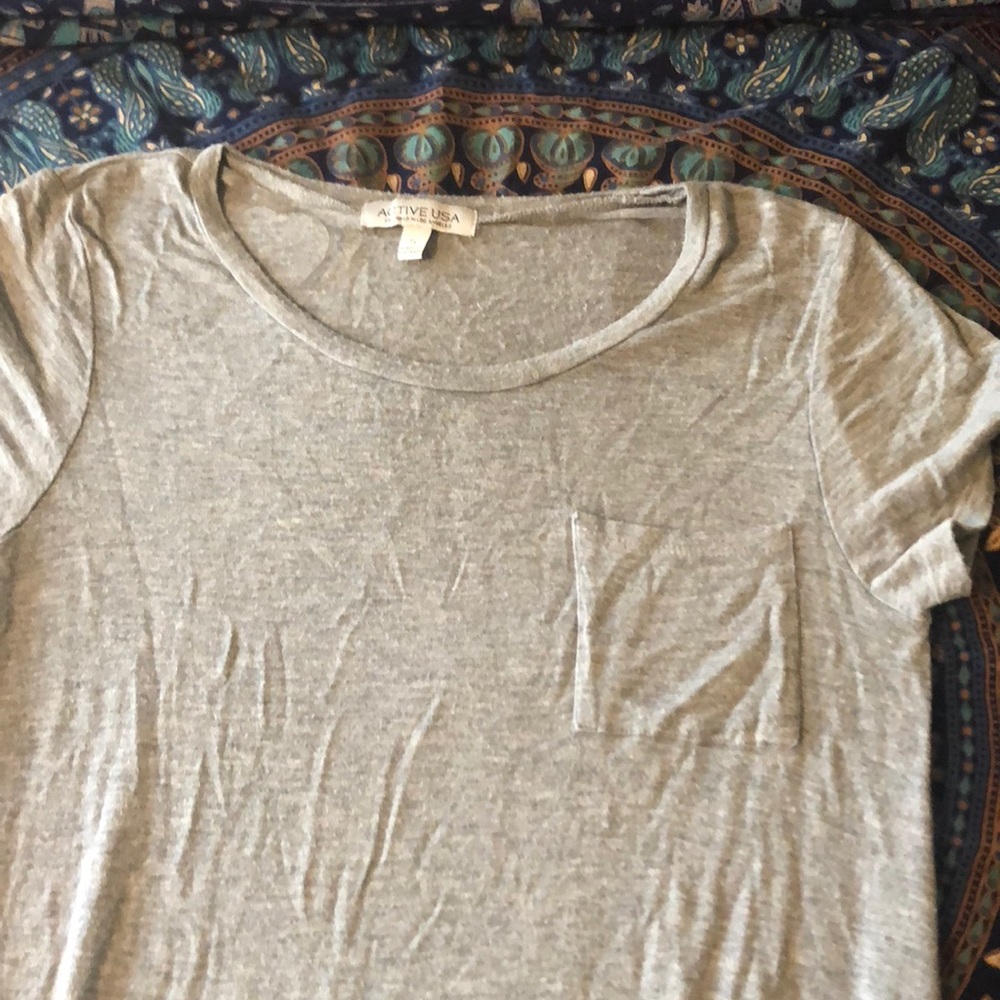 gray, short sleeve t-shirt, pocket in the front.